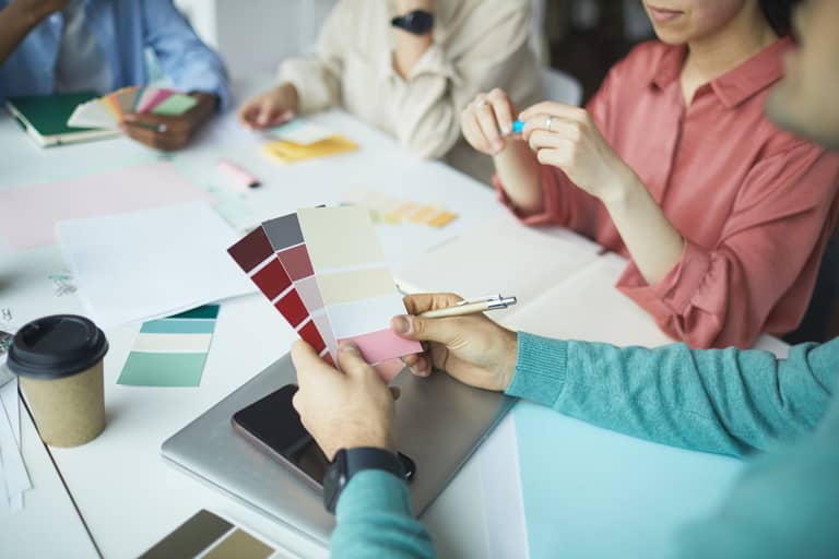 Designer holding colored palette